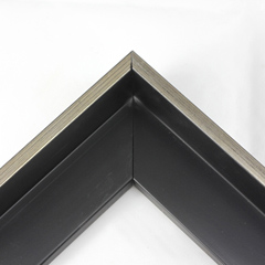 This Medium, L-shaped floating contemporary canvas frame in matte black features a thin brushed Silver face.

*Note: These solid wood, custom canvas floaters are for stretched canvas prints and paintings, and raised wood panels.