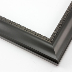 This shallow reverse scoop frame features a smooth, matte black face and a slight bevel on the outer edge.  The inner lip is a horseshoe relief design with a slight antique effect. 

1.5 " width: ideal for medium size artwork.  The simple elegance of this frame makes it the perfect border for photographs, paintings and giclee prints.