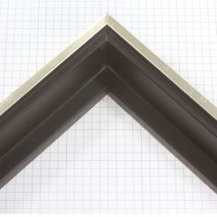 This medium, L-shaped floating contemporary canvas frame in matte black features a thin silver face.