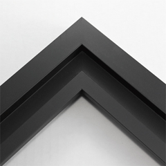 This simplistic yet modular matte black frame is designed for metal prints, acrylic prints and dry mounts. This smart design features a minimalist stepped profile that serves as a floater frame or a standard picture frame.

For the floating effect, the print can be attached on top of the inner step of the frame, without sacrificing the artwork edges.

This frame can also be used as standard picture frame. The lowered center paired with slightly raised outer lip creates a frame within a frame effect. However, due to the inner most lip of the frame, a fraction of the artwork will be hidden. But, this can be avoided with a linen liner combo.