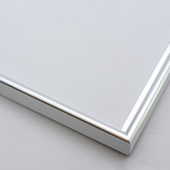 This simple metal picture frame has a bold, high-shine silver finish and curved profile. The outer drop edge has a tiny vertical ridge texture. 

.375 " width: ideal for small, medium or large-size artwork. Easily frame photographs, paintings or drawings on paper, or even Giclée canvas prints.