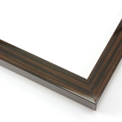 This slender, high shine frame features a walnut wash with wood grain detailing.

.875 " width: ideal for small artwork. Highlight this frame