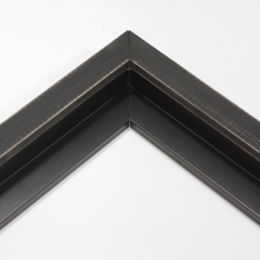 This simple, canvas floater frame features rustic wood lightly coated in charcoal grey/black paint.  The top coat is rubbed away in places to reveal the natural wood color below, for a soft, antiqued look.

3/4 " wide: ideal for small and medium-size images.  Whether photography or paintings, rural scenes and simple images will look striking in this frame.