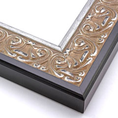 An ornate, solid wood frame featuring an intricate design overlaid with elegant silver leaf, and lightly antiqued.  A shallow scooped profile and unadorned inner edge draw the eye inward. A dark brown outer edge highlights the design.  

2.75 " width: ideal for large and oversize artworks.  Oil paintings, Giclée prints and formal family photos will be equally at home encased in this traditional frame.