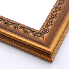 This solid wood frame features a crown moulding profile in a dark, brushed gold.  The slight distressing on the deeply scooped face and around the delicate inner design give it an antique look that suits old paintings and family portraits alike.

2.25 " width and 1 " high at outer edge: ideal for medium- to large-size images.
