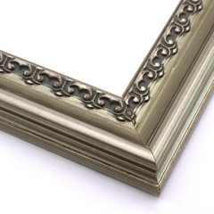 This solid wood frame features a crown moulding profile in a bold, bronze-brushed silver.  The slight distressing on the deeply scooped face and the faint red patina on the delicate inner design give it an antique look that suits old paintings, prints and family photographs alike.

2.5 " width and 1 " high at outer edge: ideal for medium- to large-size images.