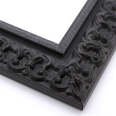 This ornate, intricate frame features a bold relief design in a dusty antiqued black. The face matched the roughly textured, raised inner lip as well.

2.75 " width: ideal for large images.  Select a strong piece of artwork to avoid it being overpowered by this decadent frame.