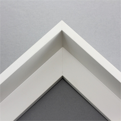 This extra tall, L-shaped floating contemporary canvas floater frame in white features a thin flat face.

*Note: These solid wood, custom canvas floaters are for stretched canvas prints and paintings, and raised wood panels.