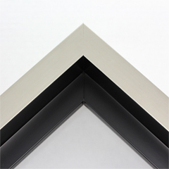 This large, L-shaped floating contemporary canvas frame in warm silver features a wide flat face.

*Note: These solid wood, custom canvas floaters are for stretched canvas prints and paintings, and raised wood panels.