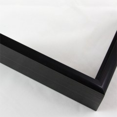 This 7/16 " traditional metal frame is a classic choice for preserving and displaying your cherished memories. This frame boasts a sleek and slim face, perfectly balanced with a deep profile, combining timeless elegance with a contemporary touch. 

The solid black color offers a sophisticated backdrop, while the horizontal brushed texture adds a subtle dimension to your artwork or photographs. With its unique texture, this frame minimizes light reflection, ensuring that your displayed content remains the center of attention without distractions. 

Elevate your display with this distinguished metal frame, enhancing the visual appeal of your cherished moments while adding a touch of sophistication to any space.
