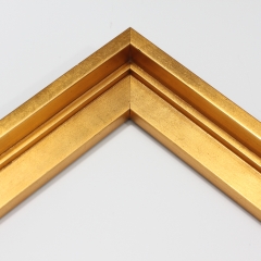 This stair step wood floater frame has a high shine, brushed gold finish with a steep upper and small lower step. The canvas will hover neatly within the simple, modern border. 

Give an authentic, fine art display to your favourite Giclée print or oil painting. This size is ideal for thin (3/4 " deep) gallery wrap canvases. The canvas may protrude slightly above the frame face. 

*Note: These solid wood, custom canvas floaters are for stretched canvas prints and paintings, and raised wood panels.