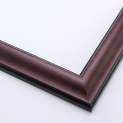This reverse scoop frame with bevelled inner lip features a mahogany wash. The thin veneer maintains the natural wood grain texture across the short edge.  Both the outer drop edge and inner lip are matte black.

1.375 " width: ideal for small images. This simple, elegant frame flatters photographs, watercolour or oil paintings, and giclee prints alike.