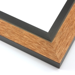 This unique frame with a raw wood face features long edge grain texture and a bright, pine-colour wash.  The frame forms a shallow V, with the matte black inner lip sloping out and then rising again (see illustration). The outer drop edge is also matte black.

2 " width: ideal for medium size artwork.  The modern style of this frame makes it a great match to more contemporary paintings and photography.