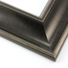 This bold frame features a steep reverse scoop profile with a broken line detail on matte black.  The inner lip drops sharply in toward the image; both edges are brushed with a subtle silver leaf.

3 " width: ideal for large or oversize artwork. Select a strong image for this frame, to ensure the heavy border doesn