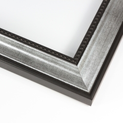 This simple, classic wood frame creates instant elegance with a gentle scoop profile and silver finish with a brushed, black patina.  Fine beading in black adorns the inner lip, while the black outer edge features a basic bevel.  

2 " width: suitable for small to large images.  Old black and white photographs, pencil or charcoal drawings, or prints.