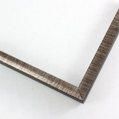 This 1/2 " frame features a scooped profile from a flat outer edge. Along with brown finish and delicate sliver detailing creating horizontal lines across the scooped profile. The colors fade to create a seamless blend. The sides of the frame features a matte black finish.

1/2 " width: ideal for small artwork. This modern frame is suitable for a wide variety of art mediums, from photographs to paintings and giclee prints.