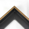 This L-shaped modern canvas floater frame, features a smooth curved wall, and a brushed gold face. 

*Note: These solid wood, custom canvas floaters are for stretched canvas prints and paintings, and raised wood panels.