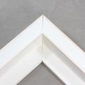 This large, L-shaped canvas floater frame features White w/Red Lines, and a 1-1/8 " flat face.

*Note: These solid wood, custom canvas floaters are for stretched canvas prints and paintings, and raised wood panels.