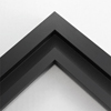 This simplistic yet modular matte black frame is designed for metal prints, acrylic prints and dry mounts. This smart design features a minimalist stepped profile that serves as a floater frame or a standard picture frame.

For the floating effect, the print can be attached on top of the inner step of the frame, without sacrificing the artwork edges.

This frame can also be used as standard picture frame. The lowered center paired with slightly raised outer lip creates a frame within a frame effect. However, due to the inner most lip of the frame, a fraction of the artwork will be hidden. But, this can be avoided with a linen liner combo.