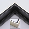 This solid wood canvas floater picture frame features a shiny brushed silver on the outside edge and narrow face.  The long inside step and base are a matte black. 

Display your favourite gallery wrapped canvas Giclée print or oil painting with authentic, fine art style. This canvas floating frame is ideal for large, thich (1.5 " deep) canvas images.

*Note: These canvas floaters are for stretched canvas prints and paintings, and raised wood panels.
