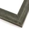 This simple, flat faced frame features rustic wood lightly coated in charcoal grey/black paint.  The top coat is rubbed away in places to reveal the natural wood color below, for a soft, antiqued look.

1-1/2 " wide: ideal for small and medium-size images.  Whether photography or paintings, rural scenes and simple images will look striking in this frame.