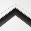 This simple, flat faced canvas floater frame features rustic wood lightly coated in white paint.  The top coat is rubbed away in places to reveal the natural wood color below, for a soft, antiqued look.

3/4 " wide: ideal for small and medium-size images.  Whether photography or paintings, rural scenes and simple images will look striking in this frame.