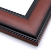 This wide frame features a smooth curve with bevelled inner and outer rims. The walnut wash has a wood grain detail, and fades to black at the edges.

3 " width: ideal for large and oversize artwork. Allow the rustic wood face to highlight a bucolic nature painting or photograph, or match the black edges to a contemporary print.