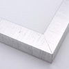 This high shine, silver foil frame features a thick, smooth profile.  A brushed finish reveals subtle lines and faint black spattering gives an antique look - simple, yet glamorous.  The .75 " drop between the glass and the face creates a striking, shadowed effect.

1.5 " width: ideal for medium- to large-size images.  Select an oil or watercolour painting, print, or abstract photograph.