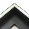 This glossy silver canvas floater frame has a U-shaped scoop face (just over 1/2 " wide) with black distressed scratching. The drop edge is black with a subtle, lined texture.

1-1/2 " rabbet depth: ideal for 1-1/2 " gallery wrapped canvas of medium or large size.  This frame looks equally striking bordering oil or acrylic paint prints and photographic prints.