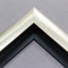 This high shine, silver foil floater frame features a thick curved profile.  A brushed finish reveals subtle lines and faint black spattering gives an antique look - simple, yet glamorous. A 1 " rabbet gives this frame a shadow-box quality.

Ieal for medium-sized and large images.  Select an oil or watercolour painting, print, or abstract photograph.