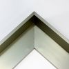 This metal canvas floater picture frame has a smooth, matte Dark Champagne finish and flat, narrow (.25 ") face. 

Ideal for medium to large size artwork on thick (1-5/8 " deep) stretcher bars.  Border gallery wrapped Giclée canvas prints or paintings with this simple, modern frame for an authentic, fine art display.

*Note: These sturdy metal, custom canvas floaters are for stretched canvas prints and paintings, and raised wood panels.

Nielsen mf14-14 Profile