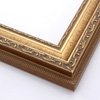 This highly detailed, solid wood frame features three distinct designs.  The dominant design tops a deep scoop of smooth, brushed gold foil and meets a small detail on the inner lip.  A drop ledge on the outer edge is decorated in a simple dash.  Matte areas within the designs create an antiqued look.

2 " width: ideal for medium- to large-size images. The detailed nature of this frame makes it suitable for bright or busy paintings or photographs.  It may overpower simpler images.