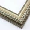 This highly detailed, solid wood frame features three distinct designs.  The dominant design tops a deep scoop of smooth, brushed silver foil and meets a small detail on the inner lip.  A drop ledge on the outer edge is decorated in a simple dash.  Matte areas within the designs create an antiqued look.

2 " width: ideal for medium- to large-size images. The detailed nature of this frame makes it suitable for bright or busy paintings or photographs.  It may overpower simpler images.