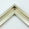 This stair step wood floater frame with a high shine lets your canvas hover neatly within the simple, modern border. The frame features a brushed silver finish with a steep upper and small lower step. The iridescent color varies slightly in different light, running from warm, muted gold to cool, opaque silver.

Give an authentic, fine art display to your favourite Giclée print or oil painting. This size is ideal for thin (3/4 " deep) gallery wrap canvases. The canvas may protrude slightly above the frame face. 

*Note: These solid wood, custom canvas floaters are for stretched canvas prints and paintings, and raised wood panels.