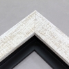 This simple but expressive floater frame features an organic wood grain face, complete with whorls and shallow ridges. The matte white finish is roughly applied for an antiqued look.

Ideal for medium and large size artworks. The natural simplicity of this countryside frame is the perfect match for nature or farmland photographs or oil paintings.