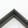 This stair step floating canvas frame in matte black with a natural wood grain texture features a shallow recessed stair below the outer face. The canvas will hover neatly, resting on the lowest, flat edge.  

Give an authentic, fine art display to your favourite canvas Giclée print or acrylic painting. This canvas floating frame is ideal for medium and large images stretched on thin (3/4 " deep) stretcher bars.

*Note: These solid wood, custom canvas floaters are for stretched canvas prints and paintings, and raised wood panels.